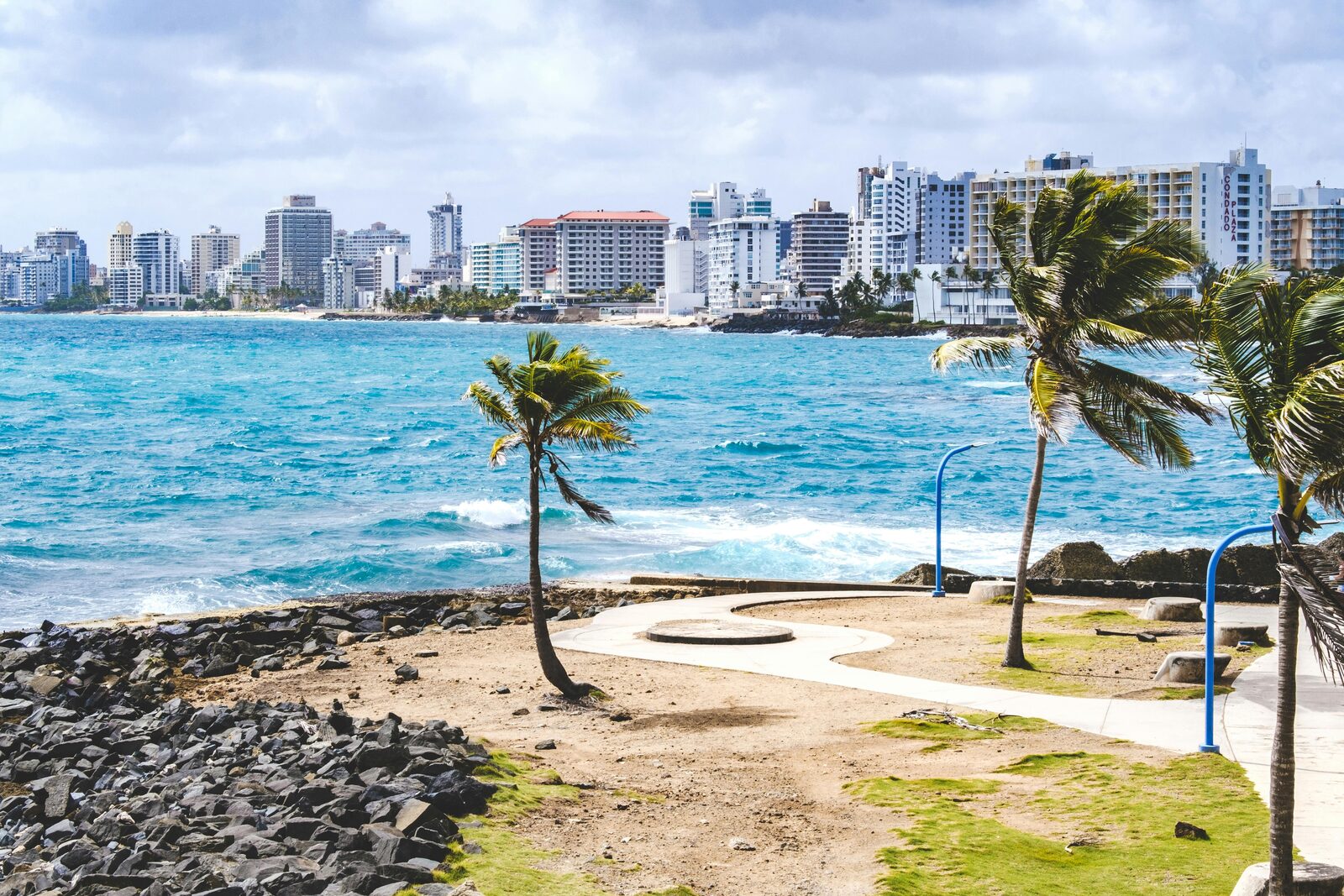 Palm trees on the white sand of Eagle Beach