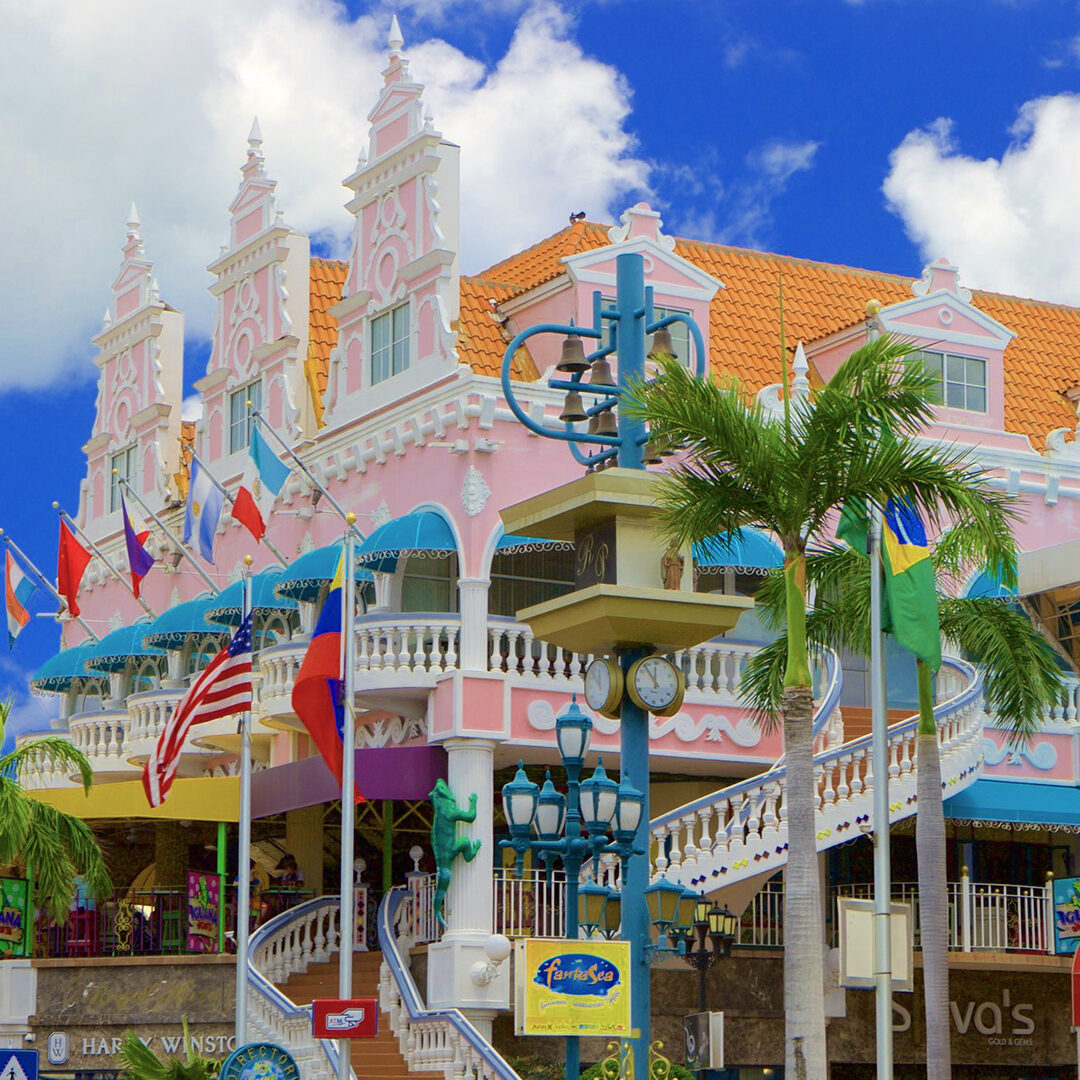Oranjestad harbour with pastel colonial buildings and sailing boats