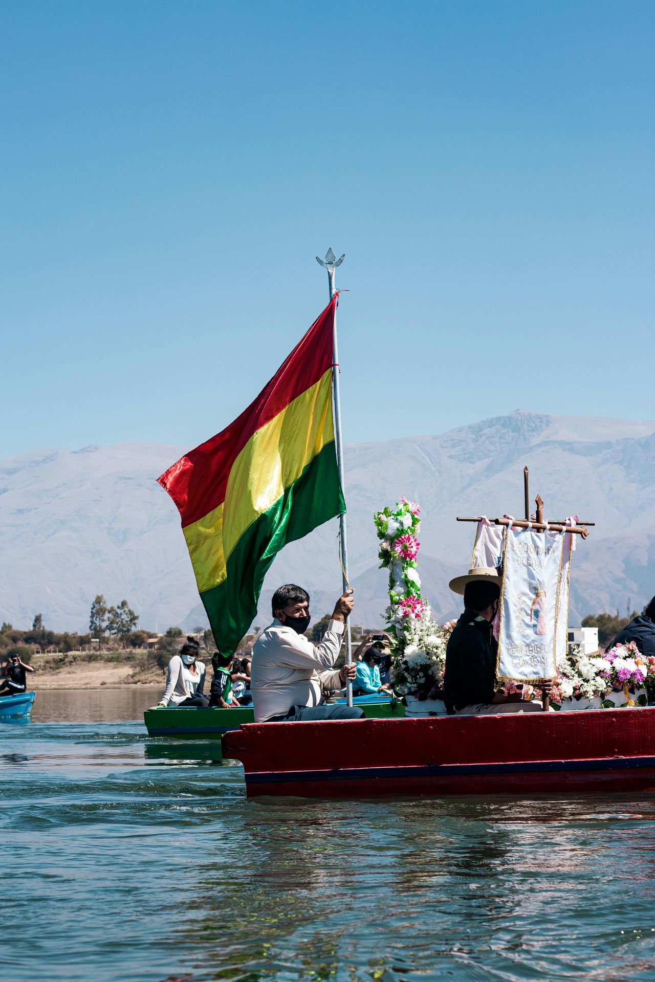 Boat with a Bolivian flag on Lake Titicaca