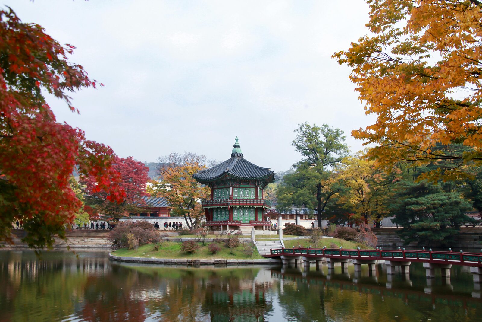 Traditional pavilion beside an autumn pond