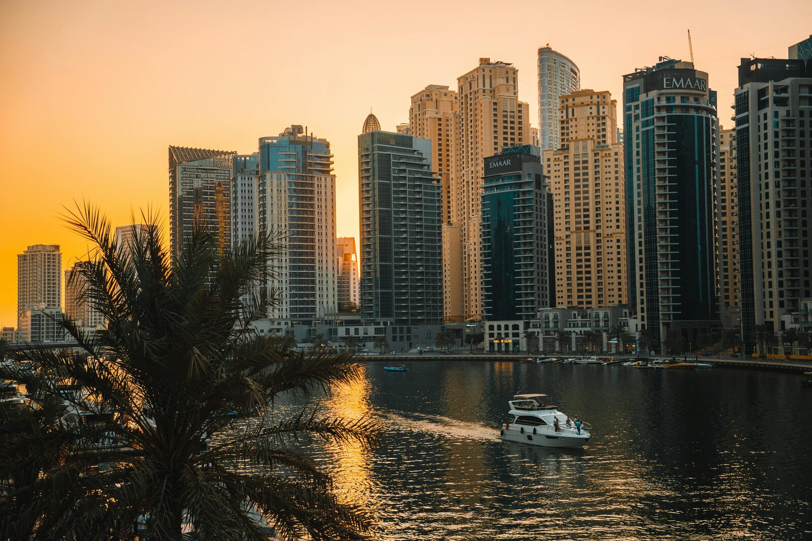 Dubai Marina at sunset with boats