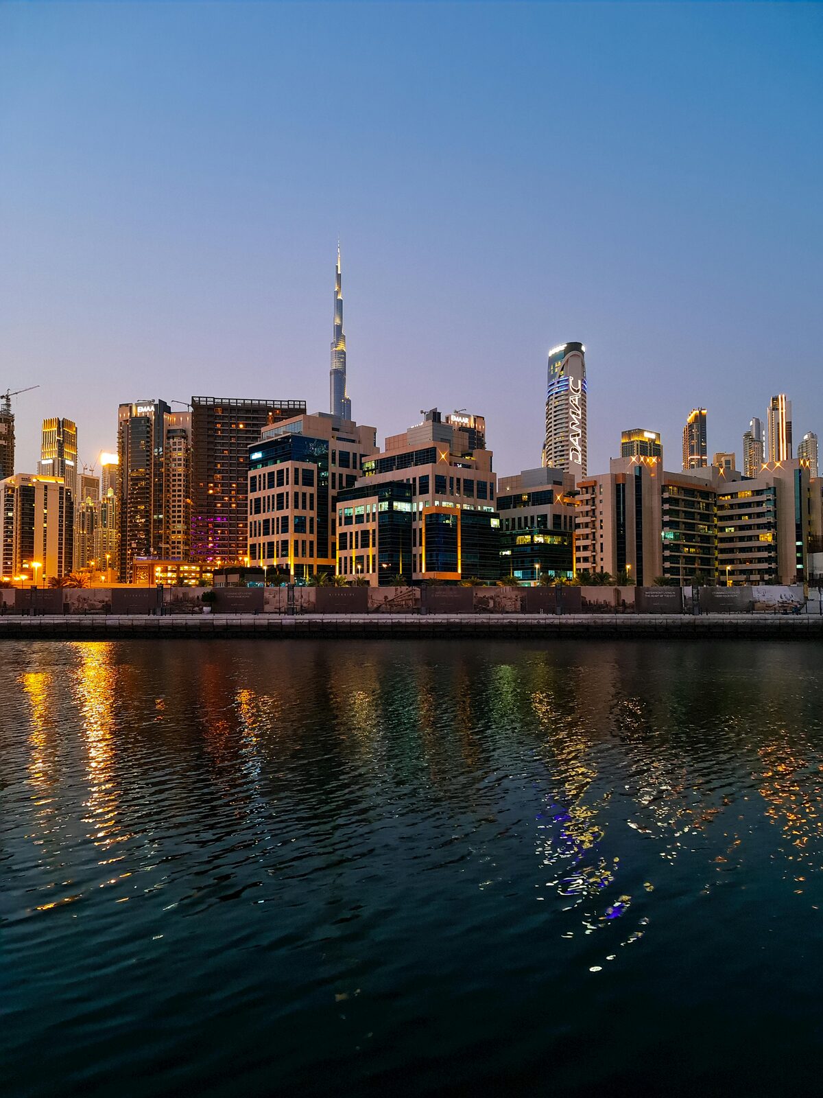 The Dubai skyline illuminated at nightfall
