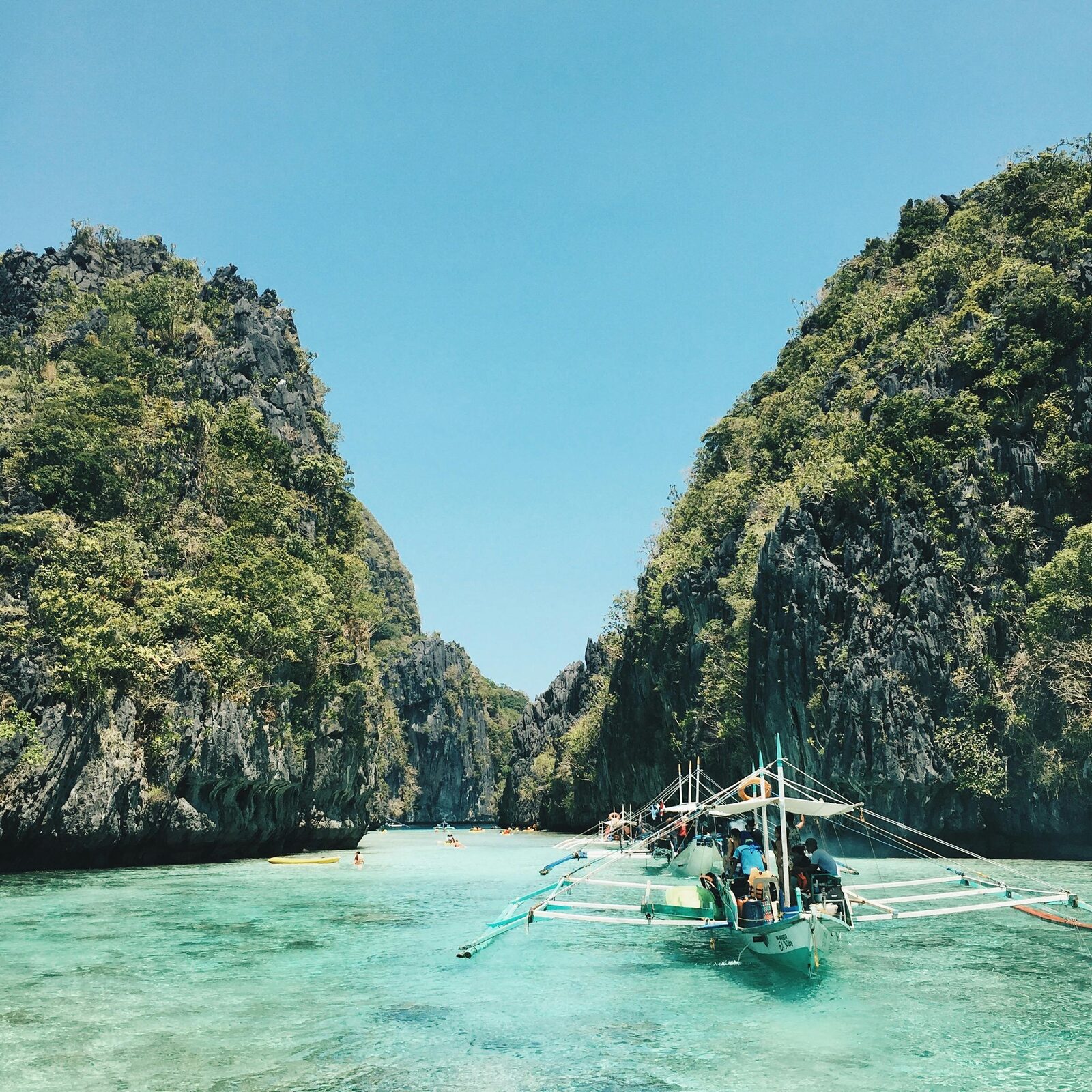 Bangkas on a white-sand beach in the Visayas