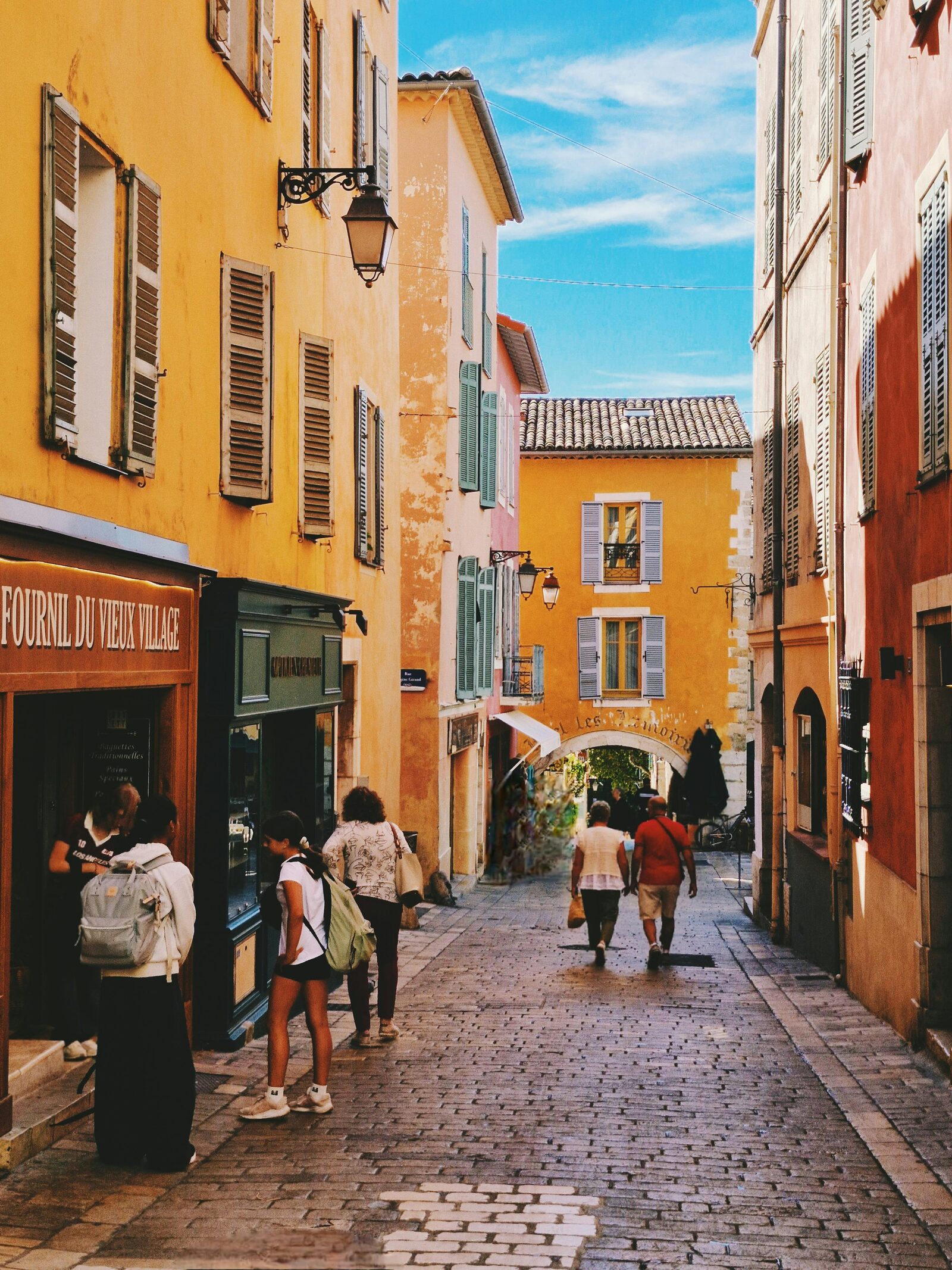 Ochre village street in the Luberon · Provence