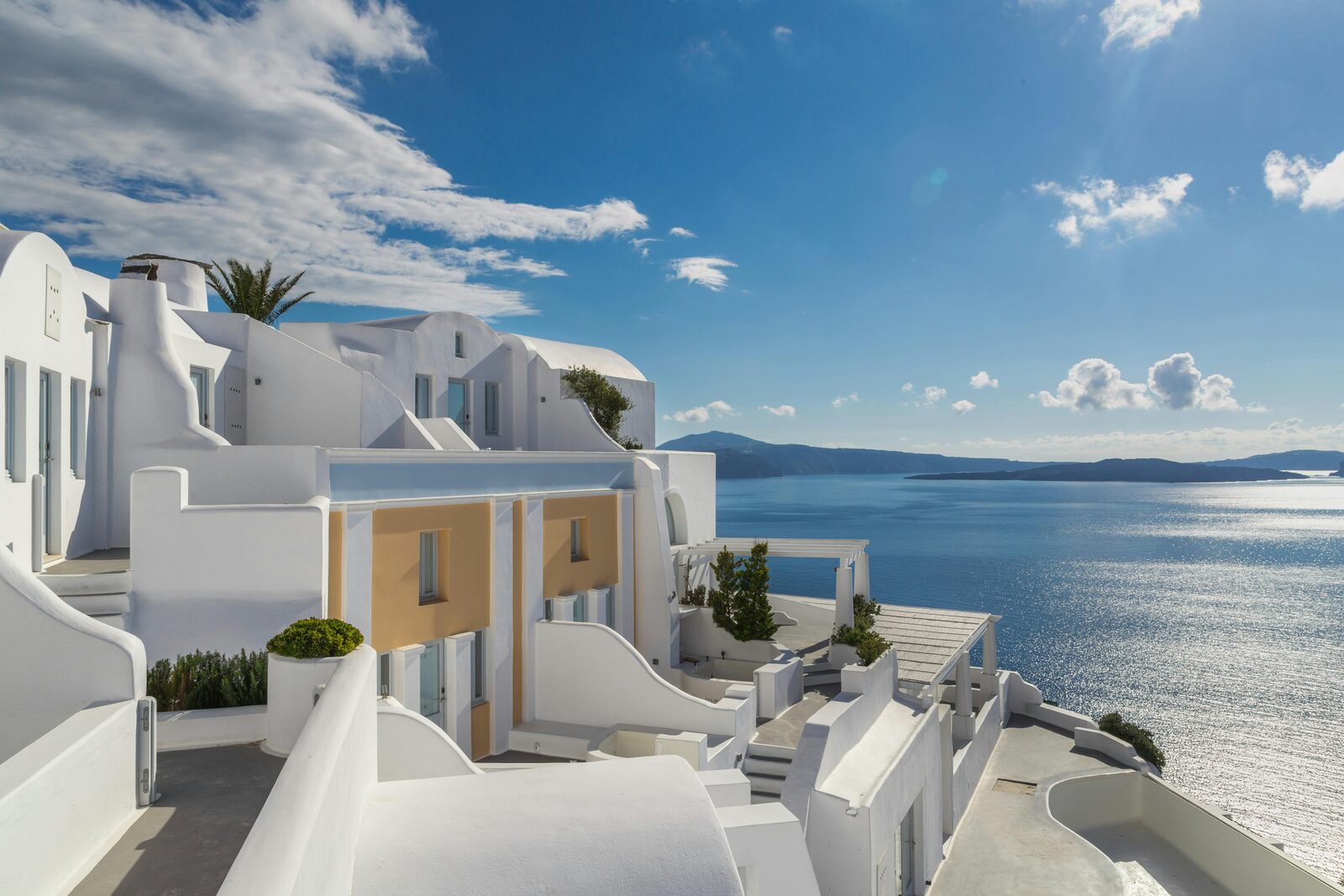 Whitewashed Cycladic chapel facing the sea