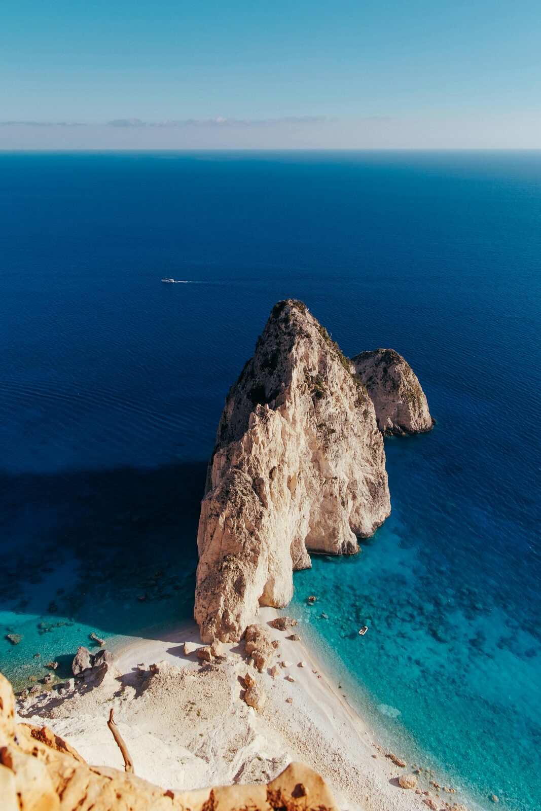 Volcanic rock coastline and turquoise Aegean waters