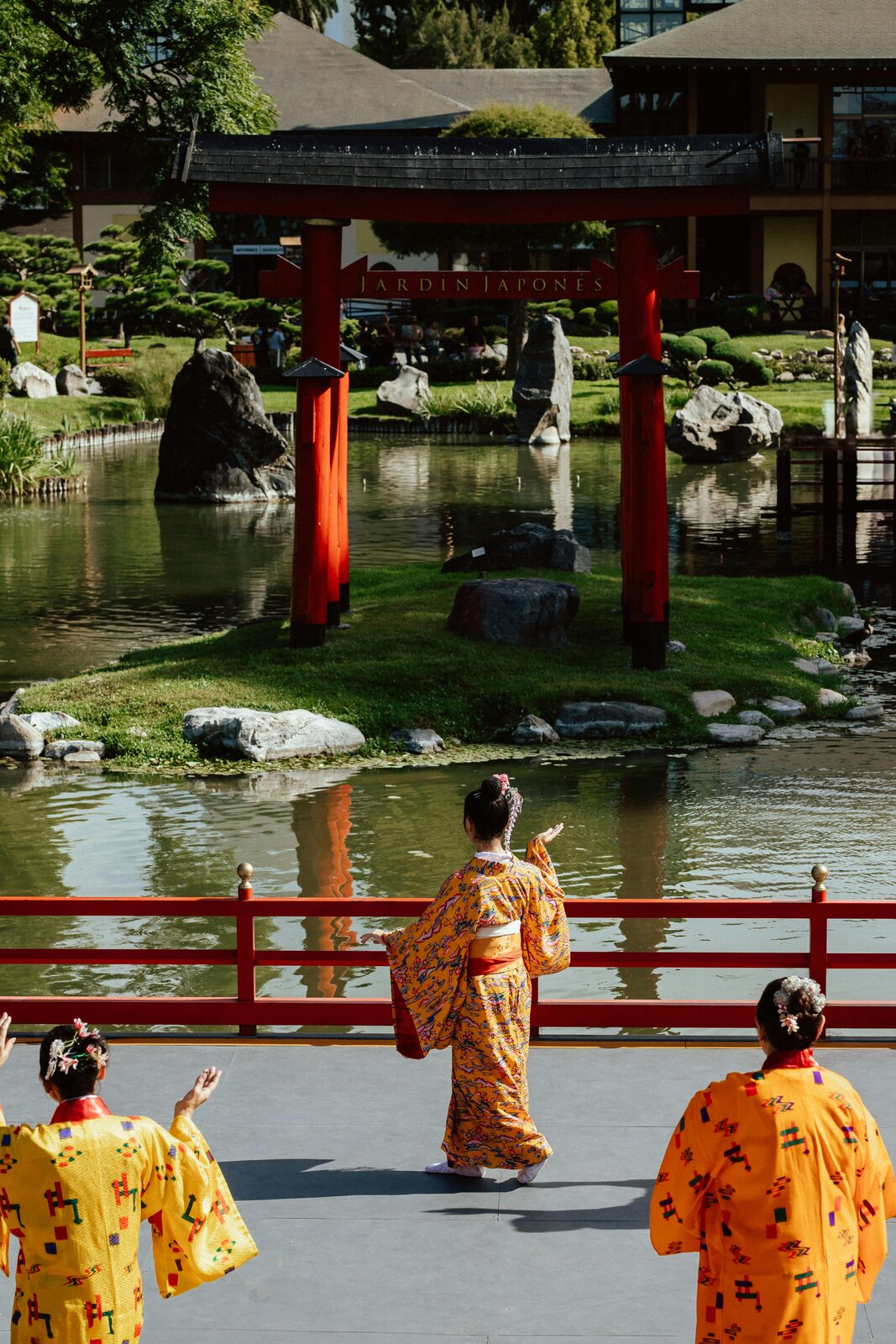 Temple garden with red bridge in Kyoto