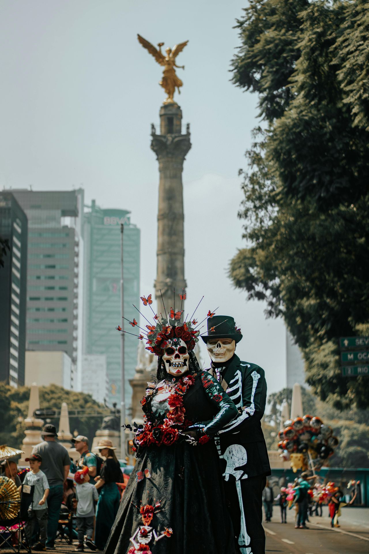 Catrinas in front of the Angel of Independence on Day of the Dead