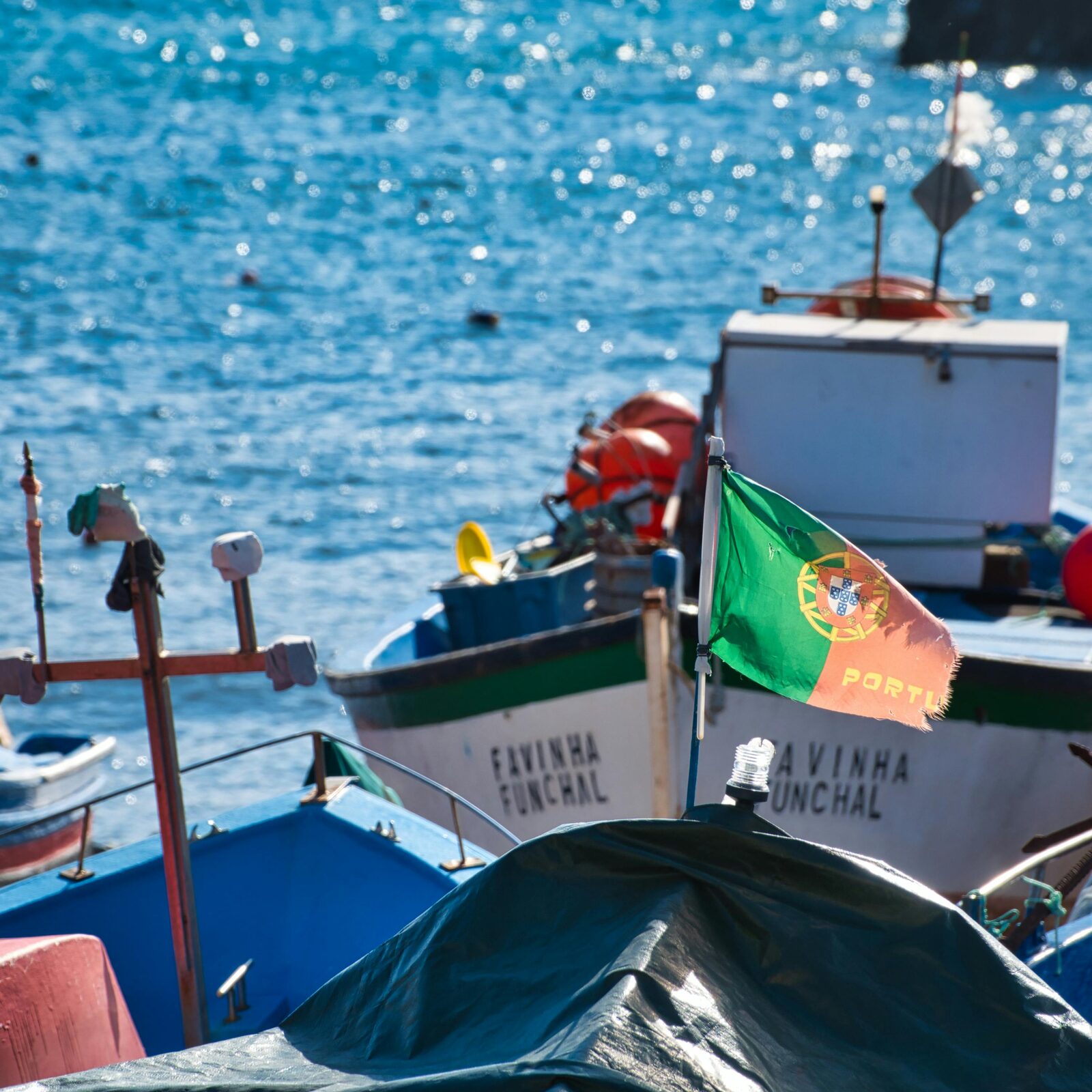 Fishing boats with the Portuguese flag in the port of Funchal, Madeira