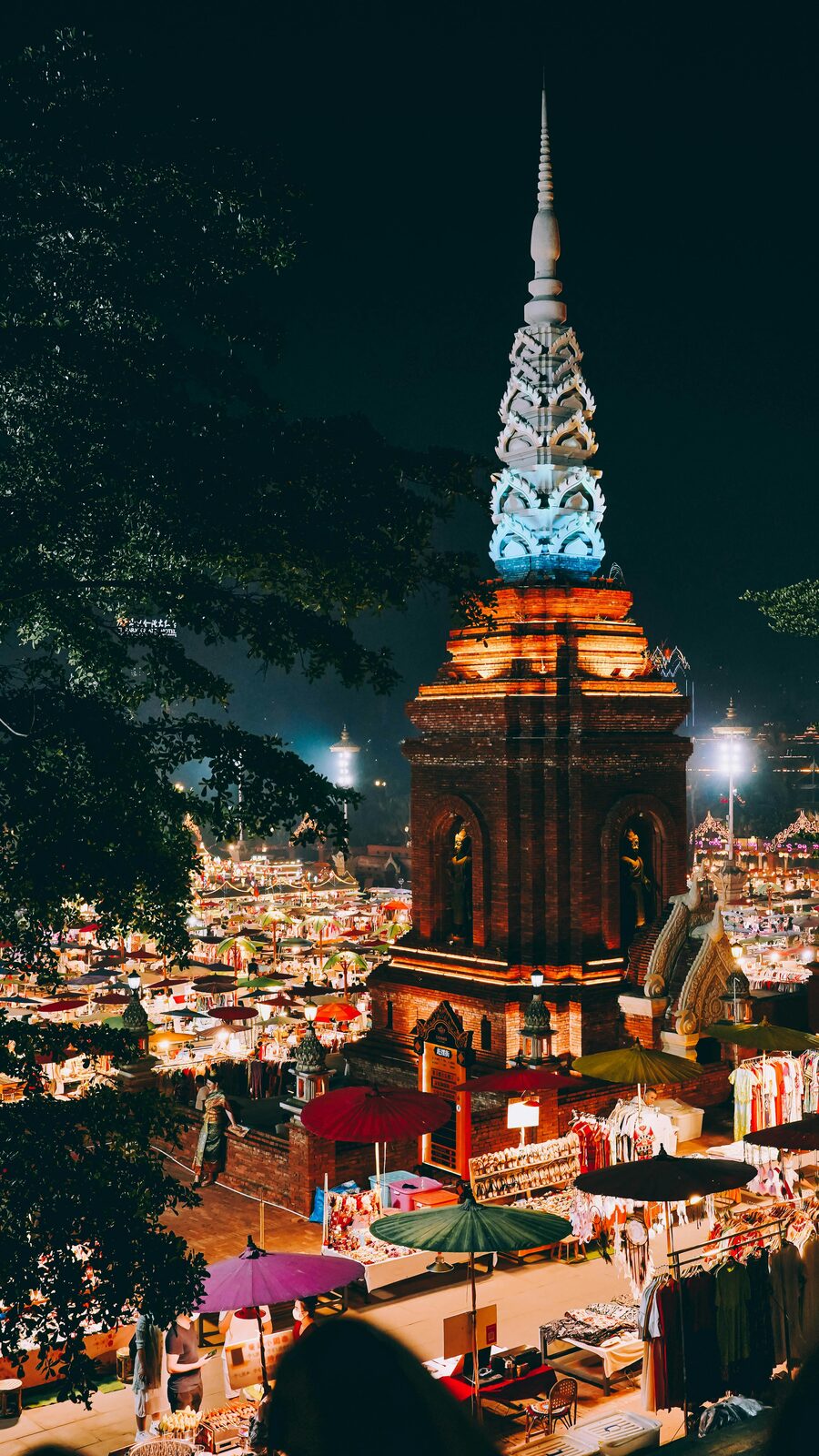 Temple illuminated at night during Yi Peng festival