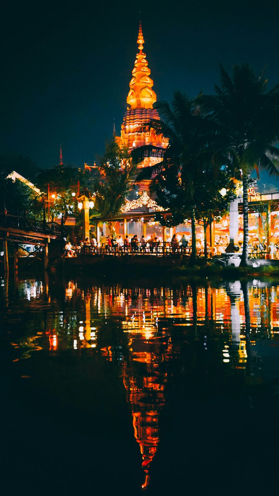 Temple reflected in the water during Loy Krathong