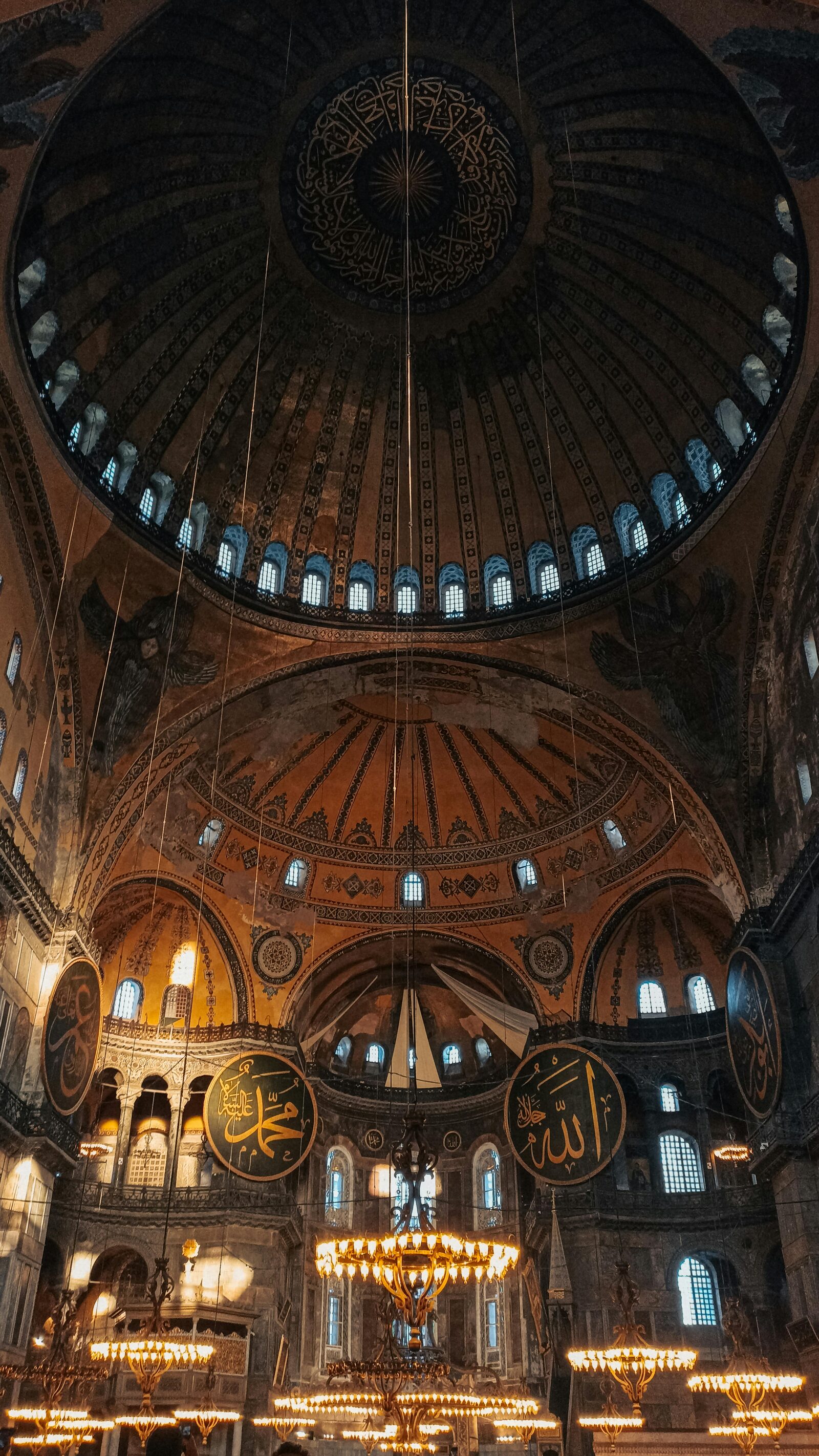 Interior of a dome with geometric decoration and Islamic calligraphy