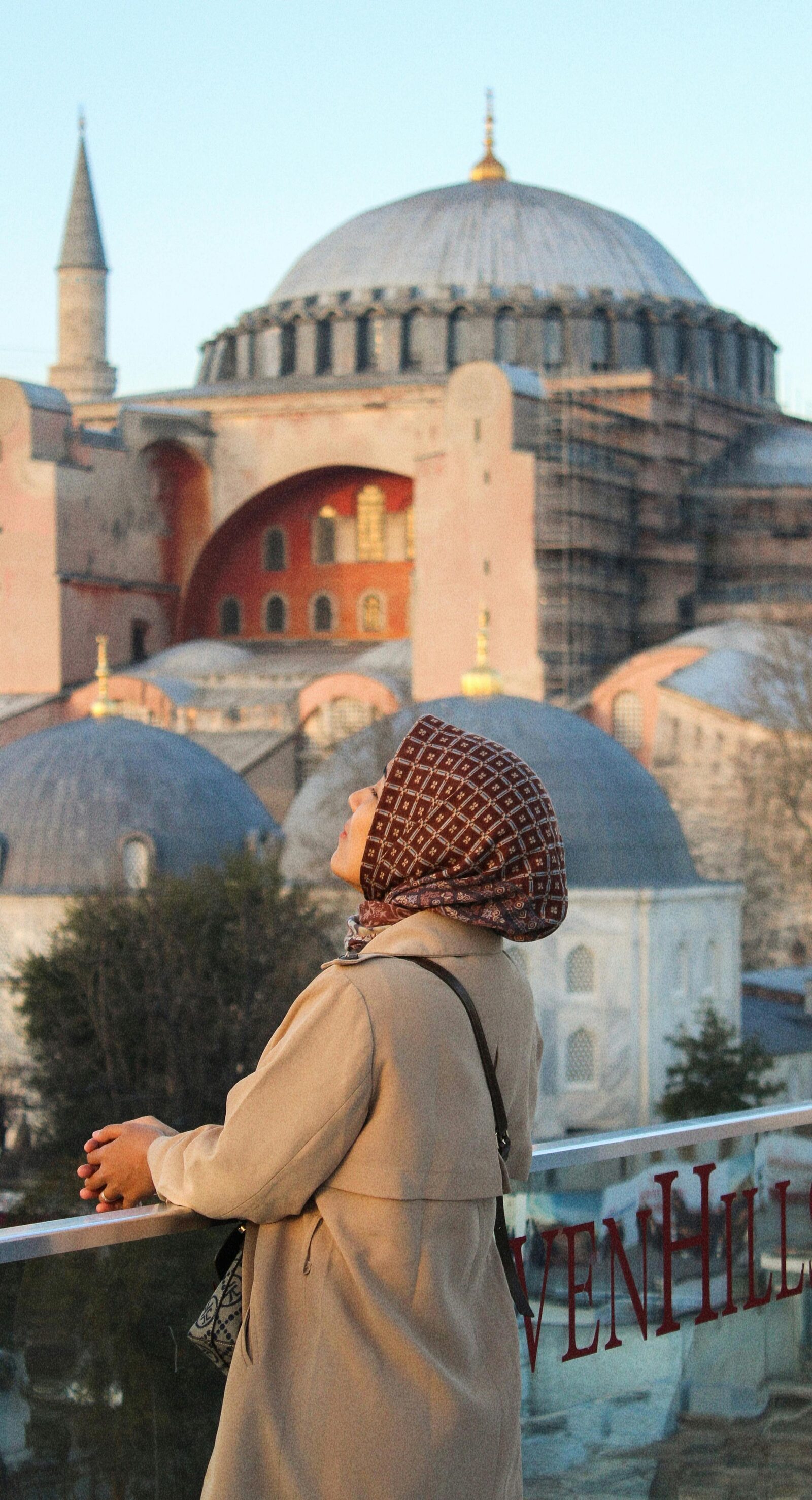 Traveller before the facade of Hagia Sophia in Istanbul